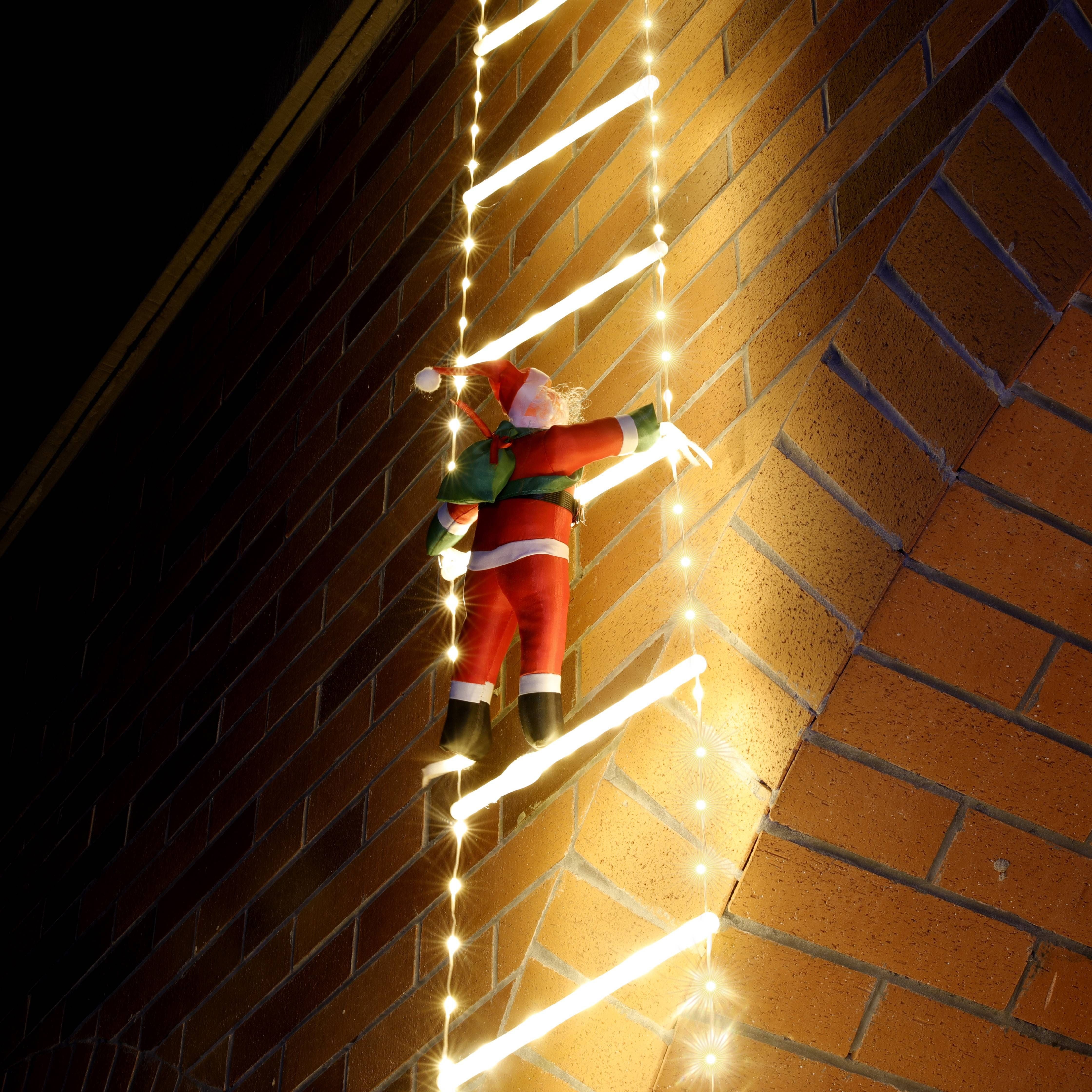 Papai Noel subindo escada com luzes de Led